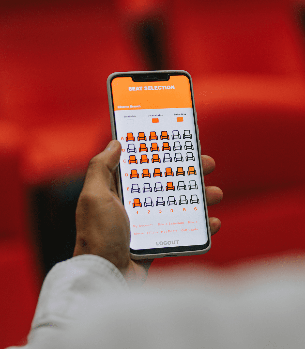 Person using seat selection on smartphone.